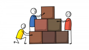 Three people building wall together